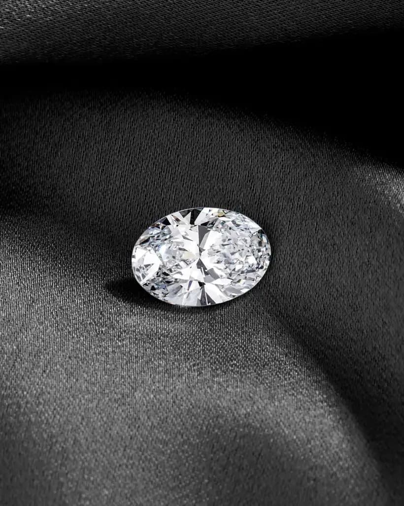 A brilliant-cut diamond on dark cloth