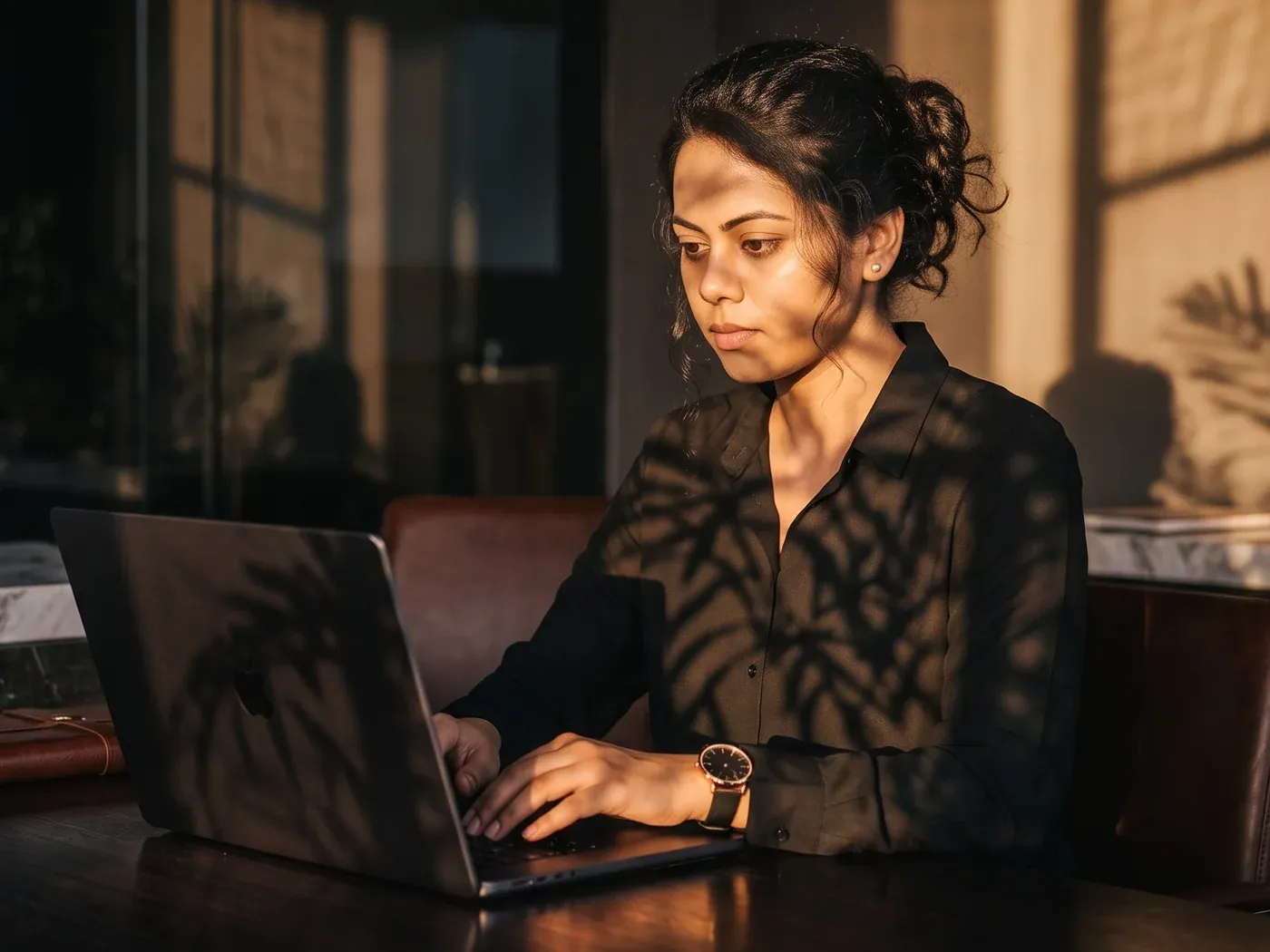 Afifa Salim Baker at her desk